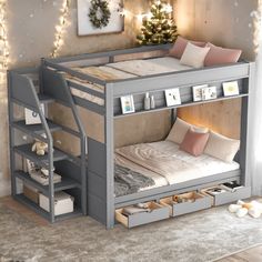 a bunk bed with drawers underneath it and lights on the wall in the corner behind it