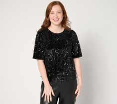 Say yes to sequins! In rich velvet, this relaxed short-sleeve top works its sparkly magic in so many scenarios -- from an elegant evening event to merrymaking with the fam. Couple with a silky midi skirt, faux-leather pants, or denim (yes!) for some classy-chic contrast. From nicole by Nicole Miller. Fall Party T-shirt With Sequins, Short Sleeve Tops For Night Out Holiday, Fall Party Short Sleeve T-shirt, Sparkling Tops For Night Out Holiday, Sparkling Tops For Holiday Night Out, Sparkling Tops For Night Out And Holiday Season, Glamorous Christmas Sequin Tops, Holiday Party T-shirt With Short Sleeves, Fall Sequined Short Sleeve Blouse