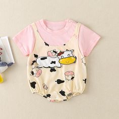 Baby Cartoon Cow Pattern Shoulder Strap Decor Bodysuit - PrettyKid Summer Short Sleeve Bodysuit With Cartoon Print, Summer Cartoon Print Short Sleeve Bodysuit, Cute Pink Short Sleeve Bodysuit For Playwear, Cute Cartoon Print Jumpsuits And Rompers For Playtime, Cute Cartoon Print Bodysuit For Playtime, Multicolor Short Sleeve Bodysuit For Playtime, Cute Bubble Romper With Cartoon Print For Playtime, Cute Cartoon Print Bubble Romper For Playtime, Cute Pink Onesie With Cartoon Print