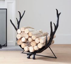 a pile of logs sitting on top of a wooden floor