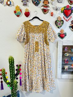 Our San Antonino dresses are unique, beautiful and perfect for any fiesta, a day at the beach or a formal event. You can easily dress it up or dress it down. Our dresses are completely hand embroidered by Artisans in Oaxaca, Mexico. It takes approximately 1 month to complete one dress.  Our San Antonino dresses are one of a kind. You will fall in love with every single detail. Each dress is hand embroidered on front chest area, sides and back with tiny floral designs inspired by the flowers in the region using beautiful color combinations. Crochet on sleeve and neckline. Across the chest, it has the "Hazme Si Puedes" (Make Me if You Can) technique, distinctive to their community. This intricate crochet technique shows tiny men and women lined together holding hands.  -Fabric & thread are 1 Embroidered Midi Dress For Garden Party, Garden Party Midi Dress With Embroidered Hem, Garden Party Midi-length Embroidered Dress, Midi-length Embroidered Dress For Garden Party, Multicolor Embroidered Floral Dress For Garden Party, Embroidered Multicolor Dresses For Garden Party, Embroidered Multicolor Dress For Garden Party, Spring Festive Long Dress, Festive Long Spring Dress