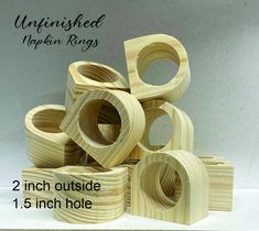 the unfinished wooden rings are stacked on top of each other