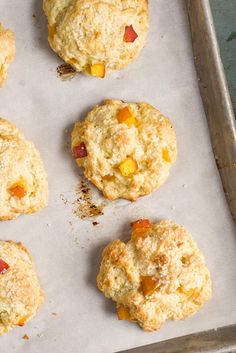 several biscuits on a baking sheet ready to be baked