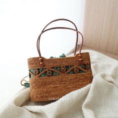 Kokonut Handwoven Rattan Handbag Bali – Lokatan Eco-friendly Brown Shoulder Bag For Vacation, Bohemian Brown Straw Bag With Large Capacity, Bohemian Brown Bucket Bag With Double Handle, Eco-friendly Shoulder Bag With Bamboo Handle For Daily Use, Brown Double Handle Straw Bag, Casual Brown Rectangular Straw Bag, Brown Handwoven Top Handle Bucket Bag, Eco-friendly Everyday Bags With Bamboo Handle, Eco-friendly Bag With Bamboo Handle