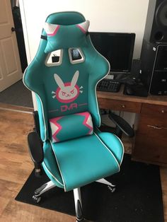 a chair that is sitting on top of a hard wood floor in front of a computer desk