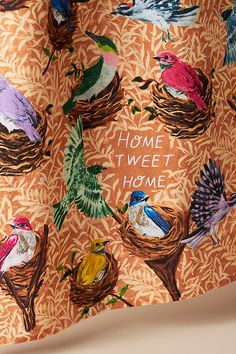 an orange background with colorful birds and nests in the center that says home tweet home