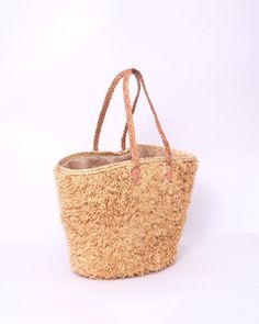 Do you want to look stylish and hippy? Get your hands on this handmade straw bag. It's high quality, eco-friendly, and handcrafted by women in Morocco. Its design is unique and timeless. Get yours now! we are proud to introduce our signature straw french bag to you. it is handmade by our talented artisan who has been working with us for years. this beautiful bag has a unique design that you would find nowhere else. the light and durable material are ideal for taking the bag on your adventures. S Eco-friendly Braided Beige Bags, Eco-friendly Beige Braided Crochet Bag, Brown Basket-shaped Palm Leaf Straw Bag, Beige Braided Crochet Bag With Natural Fiber, Beige Braided Crochet Bag In Natural Fiber, Brown Palm Leaf Straw Basket Bag, Eco-friendly Natural Braided Bags, Brown Palm Leaf Basket Straw Bag, Eco-friendly Braided Natural Color Bags