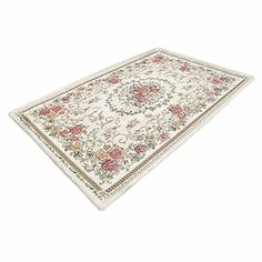 a white rug with flowers and vines on the bottom is shown in front of a white background