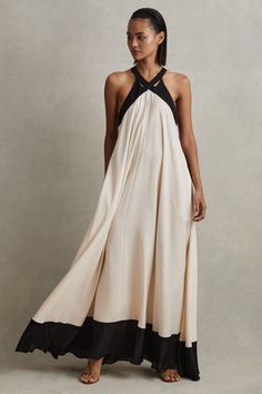 The Aubree maxi dress has a wide hem that falls against the body in elegant drapes. Contrast detailing features to the neckline, side stripes, and hem, and subtle cut-outs elevate the front. Colourblock design. Side pockets. Cut-out detailing. Zip closure to reverse. Maxi length. Relaxed fit Color Block Maxi Dress, Draped Midi Dresses, Beautiful Dresses For Women, Elegant Drapes, Maxi Dress Online, End Of Season Sale, Floor Length Dresses, Ladies Dress Design, Dress Details