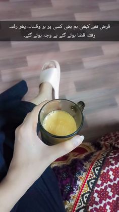 a person holding a bowl with liquid in it