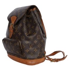 Authentic, pre-owned Louis Vuitton Brown Monogram Montsouris Backpack Mm (Medium size). Features monogram canvas with leather trim, front zippered pouch, top string closure with buckle front flap, the interior has a brown textile lining with slip pocket, adjustable shoulder straps. This bag is perfect for shopping, travel, school, and hands-free needs. Unisex bag! Authenticity Date Code: SP0024 Made in France Strap Drop: (adjustable) Montsouris Backpack, Pre Owned Louis Vuitton, Louis Vuitton Brown, Zippered Pouch, Bag Packaging, Monogram Canvas, You Bag, Zipper Pouch, Leather Trims