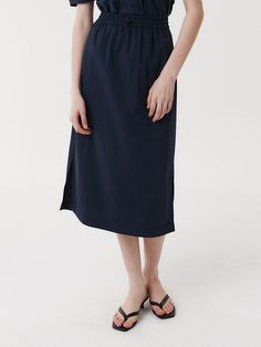 This is a clean and casual skirt by EAAH that is made out of high quality and sturdy fabric. With unique design detail and trendy mood, you can style it for your refined and casual daily outfit.- Side seam pocket- Set up with matching blouse- Elastic banding and string and stopper detail- Semi A line silhouette Versatile Cotton Skirt For Work, Versatile Skirt With Side Pockets For Work, Versatile Workwear Skirt With Side Pockets, Chic Relaxed Fit Skirt With Pockets, Solid Color Cotton Skirt For Work, Cotton Skirt For Work In Solid Color, Chic Cotton Skirt With Side Pockets, Cotton Workwear Skirt In Solid Color, Workwear Skirt With Side Pockets