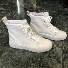 Michael Kors “Gertie” High Top Women’s Sneakers.White, Size 6.Worn Only Once. No Original Box White Vulcanized Sole Boots With Round Toe, White Vulcanized Round Toe Boots, High-top Sneakers With White Laces, Round Toe Boots With Laces And White Sole, White Lace-up Boots With Textured Sole, Michael Kors White Sole Lace-up Sneakers, Trendy High-top Sneakers With White Laces And Round Toe, White Flat High-top Sneakers For Spring, Spring Ankle-high High-top Sneakers With White Sole