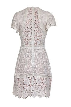 Get the perfect bridal tea look with this ivory eyelet lace dress from Rebecca Taylor. The scallop edge hem and short sleeves add a touch of elegance, while the beige lining provides comfort and coverage. Complete this timeless and sweet look with strappy sandal heels and pearl earrings. Size 4 Shell 100% Cotton Combo 100% Cotton Lining 100% Polyester Trim 100% Cotton Invisible zipper back Contrast color lining scallop lace hems Bust 34" Waist 28" Shoulder to hem 37" Sleeve length 7" Eyelet Lace Dress, Ivory Lace Dress, Bridal Tea, Scallop Edge, Sandal Heels, Strappy Sandals Heels, Lace Hem, Eyelet Lace, Eclectic Style