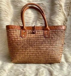 Handmade Rattan Handbags – Boho Living Room Brown Woven Leather Straw Bag With Double Handle, Brown Double Handle Woven Leather Straw Bag, Brown Rectangular Woven Leather Beach Bag, Natural Woven Leather Basket Bag, Natural Basket Shaped Woven Leather Bags, Rectangular Leather Straw Bag With Bamboo Handle, Casual Handwoven Leather Straw Bag, Natural Color Basket Shaped Woven Leather Bag, Leather Beach Bag With Braided Handles