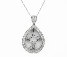 Elegantly displayed is a unique, diamond white gold 'movement' pendant. This modern piece is eye-catching from every and any angle. In their center, five brilliant round diamonds are bezel set in a see-through setting, moving freely. A crystal allows light to pass through the pendant and also adds to its unique allure. Pave set diamonds are found on the bale and pear shape gold walls. This gorgeous piece is made in 18k white gold. Gold: 18K White Gold / 9.4 Grams Setting Style: Pave/Bezel Stone: Luxury Pear-shaped Necklaces With Polished Finish, Luxury Pear-shaped Necklace With Polished Finish, Luxury Pear-shaped Polished Finish Necklaces, Luxury Pear-shaped Polished Finish Necklace, Luxury Silver Diamond Teardrop Pendant Necklace, Luxury Silver Teardrop Pendant Diamond Necklace, White Gold Diamond Necklace With Vvs Clarity Teardrop Pendant, Luxury White Gold Teardrop Pendant Diamond Necklace, Wedding Pendant Diamond Necklace With Polished Finish