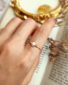 ✨ Tiny Freshwater Pearl Ring with choices of 14K Gold Filled, Rose Gold Filled or 925 Sterling Silver, June Birthstone Gift • Pearl Size: 4 mm• Ring Band: 0.8 mm • Handmade in your ring size with natural gemstone beads. • Dainty & cute. The ring is slim and petite, yet durable to wear daily. • Gold-filled is known for its lasting quality. The ring will not tarnish or turn color. You can wear them every day or even in a shower.• Hypoallergenic. You won’t have to worry about allergies from metal s Elegant Everyday Crystal Birthstone Ring, Elegant Everyday Crystal Ring, Elegant Hypoallergenic Birthstone Ring As A Promise Ring, Delicate Round Pearl Ring For Everyday, Tiny Everyday Pearl Ring, Delicate Everyday Round Pearl Ring, Fine Jewelry Pearl Ring With Birthstone For Gift, Elegant 14k Gold-filled Birthstone Rings, Dainty Pearl Promise Ring With Birthstone