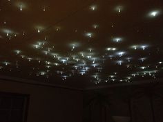 the ceiling is covered with many lights in different shapes and sizes, including small stars