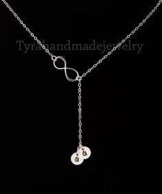 A sideways infinity lariat with initialed disc charms:1. a sterling silver infinity charm (19x8mm) at the Y joint2. one or more sterling silver disc (5/16 inch, 22 ga) each stamped with an initial in your choice of font3. a sterling silver chain (length customizable) closed with a lobster claspAll components are sterling silver.Packaged in my shop's beautiful, premium quality signature gift box (pictured) ��You can expect the highest stamping quality from my shop - thick gauge discs, uniformly d Necklace Family, Infinity Charm, Family Necklace, Fine Silver Jewelry, Initial Monogram, Y Necklace, Infinity Necklace, Gift Graduation, Monogram Necklace