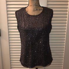 Beautiful Glittery Black/Rainbow Colored Sleeveless Top By Ronni Nicole. Pit To Pit Measures Approximately 19.25” Laying Flat And Length Is Approximately 22.5” From Top Of Shoulder To Hem. Nwt Condition! Party Season Shimmer Tank Top, Sleeveless Disco Tops For Evening, Disco Style Sleeveless Evening Tops, Sleeveless Shimmer Top For Party, Fitted Shimmer Tank Top For Night Out, Glamorous Fitted Shimmer Tank Top, Glamorous Stretch Glitter Top, Sequin Sleeveless Blouse Tank Top For Evening, Glamorous Stretch Top With Sparkling Details