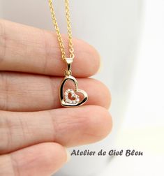 This stunning heart in heart necklace is simple and unique, which is a perfect gift for someone you love and perfect as bridesmaid gift. This cz heart in heart necklace is made of the following: (1) gold plated cubic zirconia heart charm (10.5 x 9 mm excludes connector, thickness: 1 mm) (2) Gold plated or 14KGF necklace chain ✏️ Please choose the exact length of the chain (the length includes clasp and findings). ❣️ If you are unsure about which length to choose , please leave me a note to reque Heart Cut Heart Charm Necklace For Wedding, Heart Cut Necklace With Heart Charm For Wedding, Heart Cut Heart Necklace For Mother's Day Wedding, Heart Cut Heart Necklace For Wedding On Mother's Day, Heart Cut Necklace For Wedding And Mother's Day, Heart Pendant Necklace For Valentine's Day Wedding, Delicate Heart Cut Necklace For Wedding, Heart Pendant Necklace For Wedding Gift, Delicate Heart Pendant Necklace For Wedding