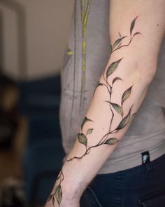 a woman with a tattoo on her arm