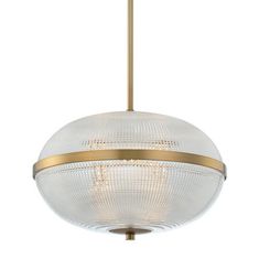 a light fixture with a circular glass ball hanging from it's center point and gold trimmings