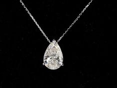 Huge 4.5ctw Pear Cut Moissanite Statement Necklace 10x15mm | 18k White/Rose/Yellow Gold Water Drop Tear Shaped Moissanite Pendant NecklaceThis is a 4.5ct pear cut Moissanite (10x15mm ) pendant necklace for women cast in solid 18K white gold. Perfect necklace to stand out and catch eyes on a night out! 45cm Gold Chain included. 》Product Details《> Gemstone: Moissanite > Shape: Pear | Water Droplet> Moissanite Stone Size: 4.5ctw 10x15mm> Color: DEF White/Colorless > Cut Grade: Excell Luxury Pear-shaped Solitaire Necklace For Wedding, Formal Pear-shaped Solitaire Necklace With Diamond Cut, Drop White Solitaire Necklace For Formal Occasions, Formal Pear-shaped Solitaire Necklace, Halo Engagement Ring Sets, Gold Water, Bubble Necklaces, Moissanite Necklace, Bezel Pendant