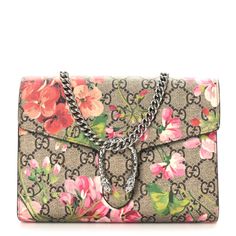 This is an authentic GUCCI GG Supreme Monogram Blooms Mini Dionysus Chain Wallet in Beige, Multicolor, and Dry Rose. This stylish bag is crafted ofGucci GG monogram-coated canvas, with a beautiful overlay of pink and red flowers.This shoulder bag features an optional aged silver chain shoulder strapand a textured horseshoe closure with tiger heads at the end.This opens to a partitioned dusty rose leatherinterior with card slots, patch pockets, and a zipper compartment. Gucci Bag Dionysus, Pink And Red Flowers, Dry Rose, Gucci Clutch, Gucci Crossbody Bag, Gucci Crossbody, Gg Monogram, Gucci Monogram, Chain Wallet