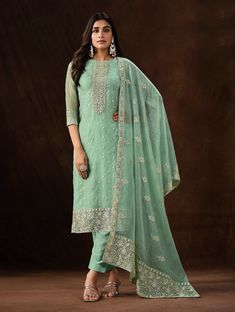 COLOR : Mint Green FABRIC : Top - Soft Organza, Bottom - Dull Santoon, Dupatta - Soft Organza WORK : Heavy Resham Embroidery, Zari, Sequins, Lace BorderOCCASION : Engagement, Party Wear, Festival READY-TO-WEAR : No STITCHING : Available as semi-stitched fabric, can be stitched using standard size option (+$20). Note: There might be a slight color variation due to lighting and flash used during photoshoot. The bright shade seen is the best closer view of fabric's color. Pista Green Straight Kurta Sets For Reception, Fitted Pista Green Palazzo Set With Intricate Embroidery, Pista Green Georgette Palazzo Set For Wedding, Embroidered Pista Green Palazzo Set For Wedding, Reception Fitted Salwar Kameez With Chikankari Embroidery, Fitted Chikankari Salwar Kameez For Reception, Fitted Green Churidar For Reception, Green Fitted Churidar For Reception, Green Self-design Palazzo Set For Wedding