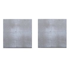 two square metal panels on a white background