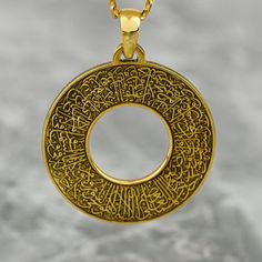 Crafted with meticulous attention to detail, the Ayatul Kursi Circle Necklace embodies elegance and symbolism in Islamic jewelry. This exquisite piece is made from high-quality sterling silver and features intricate Arabic calligraphy that showcases the powerful Ayatul Kursi verse from the Quran. The delicate circle design adds a touch of sophistication to this gold-plated pendant, making it a perfect gift for Muslim women seeking a blend of style and spirituality. The necklace exudes timeless b Islamic Jewelry, Pendant Making, Ayatul Kursi, Circle Necklace, Circle Design, Muslim Women, Necklace Silver, Timeless Beauty, Pendant Necklaces