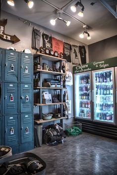 a room filled with lots of lockers next to a wall full of beer bottles