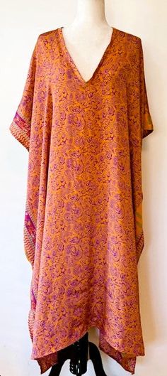 Our Everyday Rasgulla Muu is bound to be your most versatile staple piece. Crafted with our ultra lux vintage rasgulla silk, this design features an ankle length hem and V-neckline with elbow length sleeves and interior side pockets. Dress her up or down with accessories. Goes almost everywhere. Add a belt for the office, jewelry for a night out, sandals for beach and resort. One size fits most. Price$ 80.00 One Size fits most: recommended 00-24 Material: Vintage Rasgulla Silk. Care: This produc Multi Wrap Dress, Sandals For Beach, Infinity Dress Bridesmaid, Green Linen Dress, Office Jewelry, Multiway Dress, Long Linen Dress, Rust Dress, Linen Maxi Dress