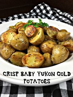 crisp baby yukon gold potatoes in a white bowl on a black and white checkered tablecloth