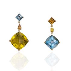 Evening Primrose earrings are designed to accentuate individuality with magnificent shades of golden citrine and London blue topaz. Delicate yet strong, these drops sparkle in the sunlight, dazzled with cognac and yellow diamond accents. 18k yellow gold Golden citrine, 14ctw London blue topaz, 9ctw Diamonds, 0.24ctw In stock Luxury Yellow Gold Topaz Earrings, Evening Primrose, London Blue Topaz, London Blue, Cuff Earrings, Yellow Diamond, Blue Topaz, Cognac, Citrine