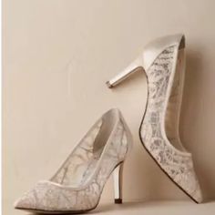 Elegant Floral Lace Heels With Point Toe In Ivory With Silver Threads Running Through The Lace. Low Heels For All Night Comfort. New In Box Color: Ivory/Silver Product Details Fabric Type: 100% Fabric Origin: Imported Leather Lining Leather Stock 3 1/2 Inch Heel Elegant Lace Heels With Pointed Toe, Off White Elegant Heels For Evening, Feminine Beige Pointed Toe Wedding Shoes, Elegant Off White Evening Heels, Elegant Lace-up Heels In Lace Material, Elegant Off White Heels For Formal Occasions, Elegant Off White Formal Heels, Cream Lace Pointed Toe Wedding Shoes, Elegant Lace Heels With Round Toe