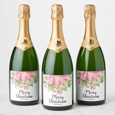 three bottles of champagne are shown in this image with the label on one bottle and the other