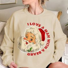 Get into the festive spirit with this adorable and humorous Santa Beard Sweatshirt! Perfect for cozy winter days, this cute Christmas crewneck will bring a smile to everyone's face. The graphic features a playful Santa beard, making it a fun holiday staple for women who love spreading Christmas cheer. Soft & Comfortable: Made from a blend of cotton and polyester, this sweatshirt is super soft on the skin and ideal for layering during cold winter days. Perfect Fit: Available in multiple sizes, designed to offer a relaxed fit that's flattering for all body types. Festive Design: The quirky Santa beard graphic adds a dash of humor, making this sweater a standout piece for holiday parties, family gatherings, or casual outings. Great Gift Idea: Looking for a cute Christmas gift? This sweatshirt Funny Winter Sweatshirt With Letter Print, Funny Graphic Print Sweatshirt For Winter, Funny Crew Neck T-shirt For Winter, Funny Print Winter Sweatshirt, Funny Print Sweatshirt For Winter, Funny Long Sleeve Winter Sweatshirt, Funny Crew Neck Tops For Winter, Christmas Crew Neck Cotton Sweater, Christmas Cotton Crew Neck Sweater