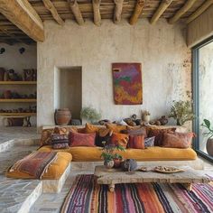 a living room filled with lots of furniture and decor