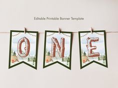 three banners with the word one hanging from clothes pins on a line that reads printable printable banner templates