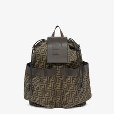 Large backpack in jacquard fabric with brown FF motif. Brown leather details and flap with embossed Fendi Roma logo. Features two front pockets, drawstring closure, inner zip pocket and palladium-finish metalware. It can be worn over the shoulder or held by hand thanks to the additional detachable strap. Made in Italy. One Size Roma Logo, Fendi Logo Design, Fendi Logo, Stylish Backpacks, Perfume Brands, Large Backpack, Jacquard Fabric, Black Nylons, Drawstring Backpack