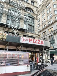 a pizza restaurant in the middle of a city