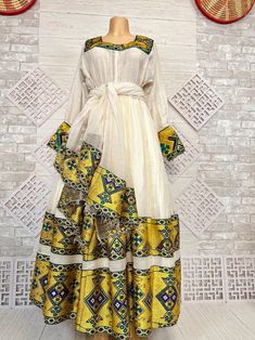 Elegant Ethiopian and Eritrean Traditional Dresskamis - Etsy Traditional Yellow Kaftan For Festive Occasions, Traditional Silk Kaftan For Eid, Traditional Silk Floor-length Kaftan, Traditional Floor-length Dresses With Traditional Patterns, Ceremonial Habesha Kemis With Traditional Patterns, Traditional Dresses With Traditional Patterns For Eid, Traditional Maxi Kurta For Ceremonies, Ceremonial Folk Dresses With Traditional Patterns, Traditional Maxi Length Kurta For Ceremonies