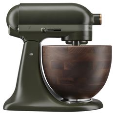 a green kitchen mixer with wooden bowl on it's side and the handle extended