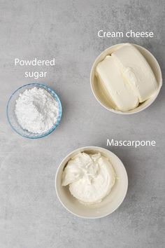 three bowls containing cream, sugar and mascarpone on a gray surface with words describing the ingredients