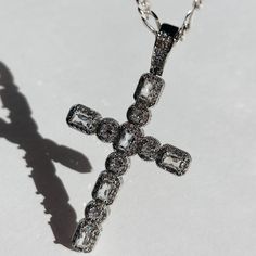 Introducing the exquisite Hope CZ Cross Necklace - a timeless symbol of faith and style. This stunning piece features a Large White Gold CZ Cross on a Sterling Silver Flat Figaro chain. This necklace is a must in your jewelry collection for all trendy & aesthetic wearers. Product Details: 16" 3.5mm Sterling Silver Flat Figaro Chain 60mm 24K White Gold CZ Cross Charm Not Water-Wearable Made in Scottsdale, AZ Silver Spiritual Necklace With Cubic Zirconia, Spiritual Cubic Zirconia Necklaces With Diamond Accents, Spiritual Silver Necklace With Cubic Zirconia, Spiritual Silver Cubic Zirconia Necklace, White Gold Cross Jewelry For Spiritual Style, Spiritual White Gold Cross Jewelry, Luxury Cubic Zirconia Cross Jewelry, White Diamond Spiritual Jewelry, Spiritual White Diamond Jewelry