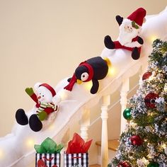 christmas decorations on the banisters with santa and snowmen