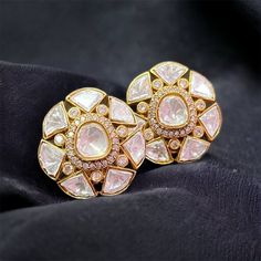 Polki Earrings, adorned with dazzling Kundan Studs and meticulously crafted Moissanite Polki accents. These exquisite Polki Stud Earrings are a masterpiece of craftsmanship, featuring Uncut Polki Diamond details that exude timeless beauty. Inspired by the opulent designs of Sabyasachi, they are the perfect addition to any collection. Embrace the allure of traditional yet contemporary jewelry with these Polki Studs, designed to enhance your style with sophistication. *𝐏𝐑𝐎𝐃𝐔𝐂𝐓 𝐃𝐄𝐓𝐀𝐈𝐋* Elegant Jhumkas With Gota Work, Elegant Bridal Earrings With Gota Work For Festive Occasion, Elegant White Chandbalis For Ceremonial Occasions, Bollywood Diamond Bridal Earrings For Wedding, Elegant Chandbalis With Cutdana For Reception, Festive Elegant Bridal Earrings With Gota Work, Elegant Cutdana Chandbalis For Reception, Elegant Silver Jhumkas With Gota Work, Kundan Chandbalis With Intricate Design For Reception