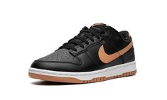 The Nike Dunk Low "Black/Amber Brown" is a versatile colorway of the classic basketball shoe with a simple and stylish look.  A decidedly fall-inspired vibe, the Dunk Low “Black/Amber Brown” features a black leather upper with tonal leather overlays.  An Amber Brown leather Swoosh logo appears on the mid-panel while classic “Nike” branding is embroidered on the heel.  More Swoosh and “Nike” logos are seen on the tongue tag.  Underfoot, a white midsole and Amber Brown-colored outsole complete the Nike Logos, Nike Branding, Amber Brown, Nike Brand, Brown Shoes, November 2, Stadium Goods, Swoosh Logo, Nike Dunk Low